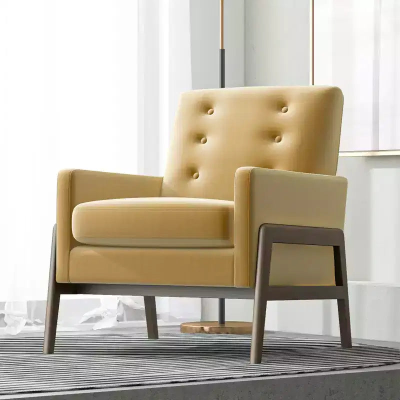 Fauteuil moderne en velours avec dossier capitonné et pieds en bois massif