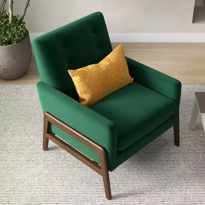 Fauteuil moderne en velours avec dossier capitonné et pieds en bois massif