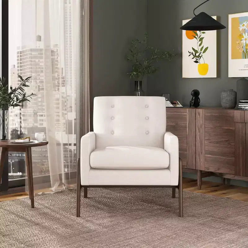 Fauteuil moderne en velours avec dossier capitonné et pieds en bois massif