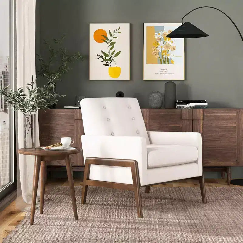 Fauteuil moderne en velours avec dossier capitonné et pieds en bois massif