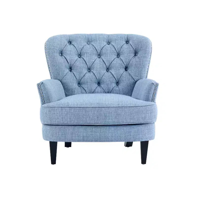 Un fauteuil inclinable capitonné de style vintage orné de rivets et de pieds en bois