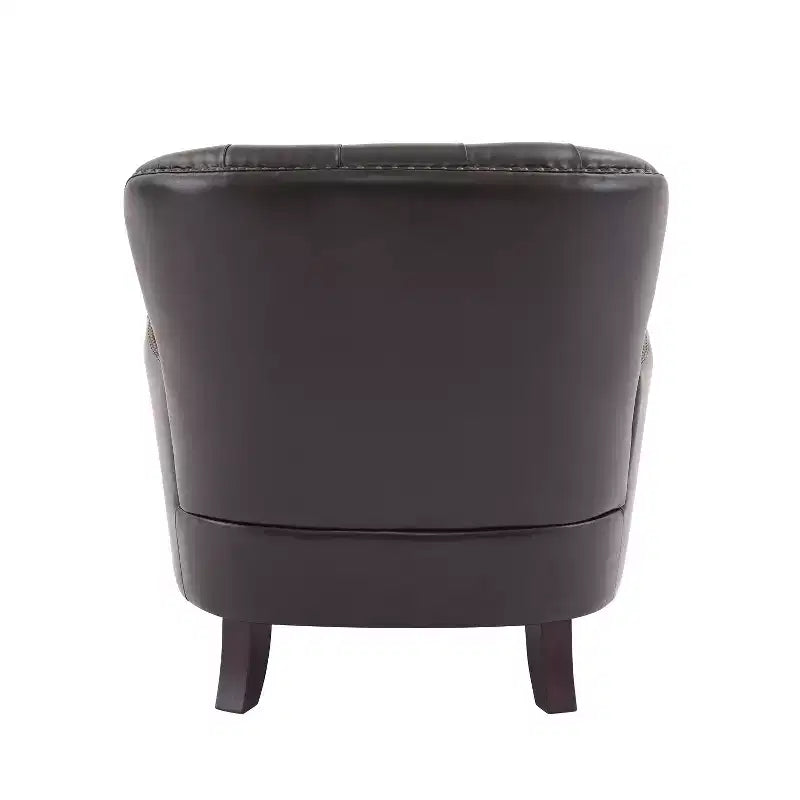 Un fauteuil inclinable capitonné de style vintage orné de rivets et de pieds en bois